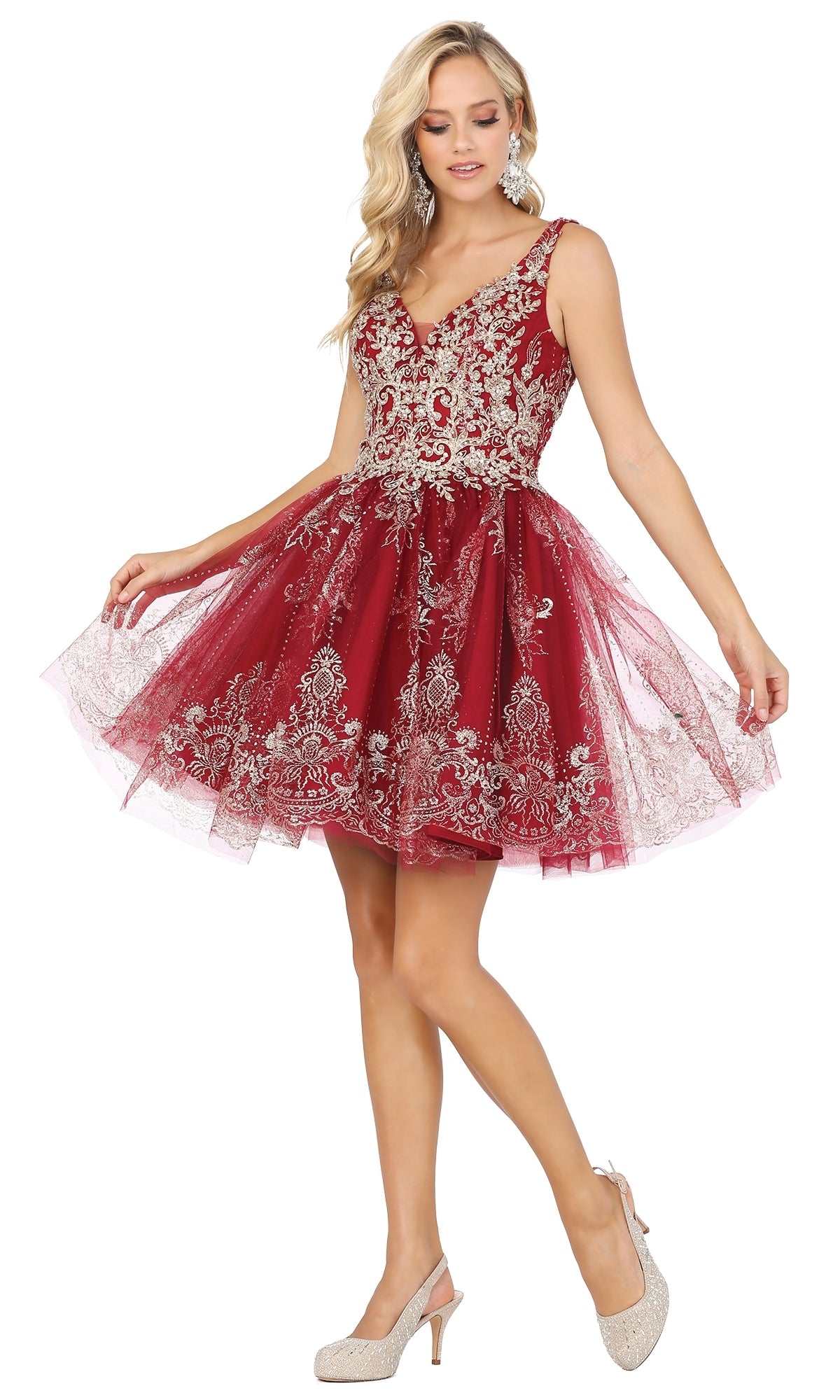 A woman poses against a white background in the Silver-Beaded Short Babydoll Hoco Dress 3237 with silver lace embroidery, paired with beige high heels.